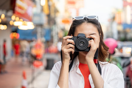 Asian woman enjoy eating street food at night market. Traveler Asian blogger women Happy tourists...