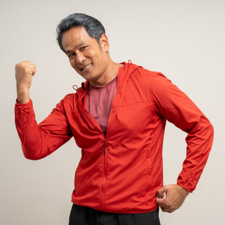 Senior asian old man with sportswear on isolated white background. Portrait happy healthy fit and...