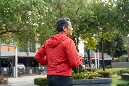 Senior old man runner exercise outdoor nature park. fitness man jogging wearing sportswear. Mature athlete man in sportswear Workout running at public park. Health and activity old man lifestyleの写真素材