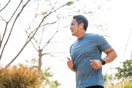 Senior old man runner exercise outdoor nature park. fitness man jogging wearing sportswear. Mature athlete man in sportswear Workout running at outdoor. Health and activity old man lifestyleの写真素材