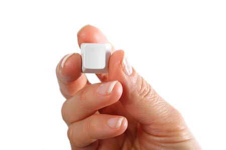 Small empty computerkeyboard key in hand, white background