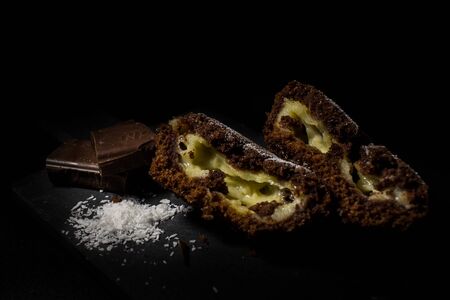 Chocolate muffin cupcake with vanilla fillingの写真素材