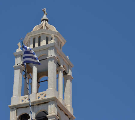 Skiathos Greek Island Tower with Greek Flagの写真素材