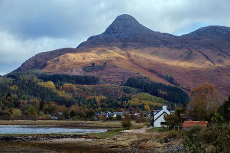 Scottish village at the foot of huge mountain. Glencoe, Scotland