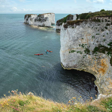 Top view of the sea, cliffs and three canoes. August - 2019. Old Harry Rocks, Englandの写真素材