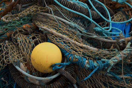 Old fishing tackle ropes nets floats. Mallaig Harbour, Scotland