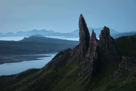 Stunning view of the high sharp cliffs towering over the lakes and the sea before dawn. The Old Man...