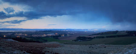 Top view of a rural Scottish landscape with town, sea and mountains. Linlithgow, Scotland