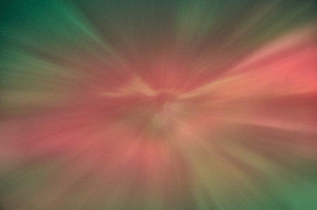 Green and red northern lights storm above our head. Scotlandの写真素材