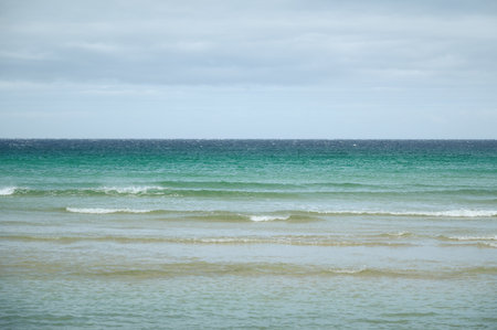 Turquoise sea and waves on a spectacular beach in the north of Scotland. Isle of Harris, Scotlandの写真素材