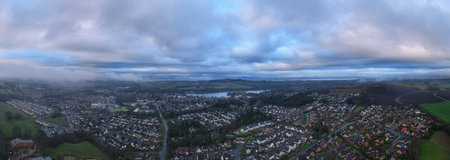 An aerial view of a small town with lake in Scotland.の写真素材