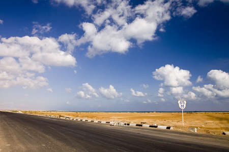 The road in the desert near seaの写真素材