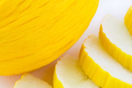 Yellow melon slices on white background, sweet fruitの写真素材