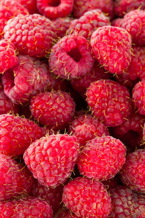 Fresh fruits raspberries background, sweet and juicy desertの写真素材