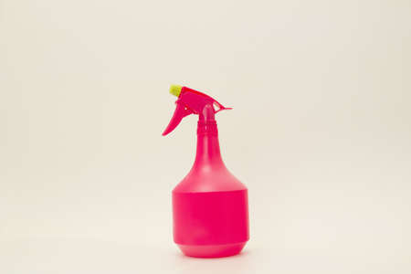 Capacity for watering flowers in red on a white backgroundの写真素材