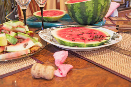 Champagne and wine glasses on a background of watermelon.の写真素材