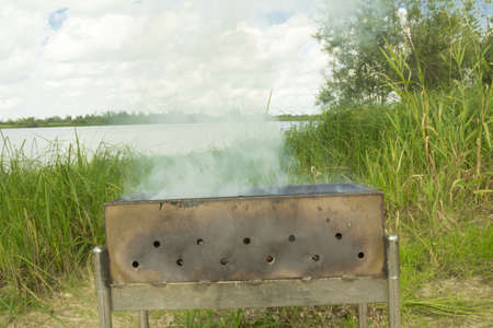 Pork with onions and tomatoes on the banks of the river.の写真素材