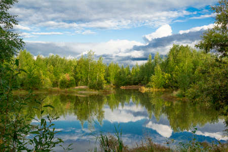 A walk on a summer morning in the forest lake.の写真素材