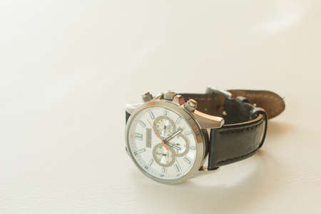 Wristwatch with kozhennym strap on a white backgroundの写真素材