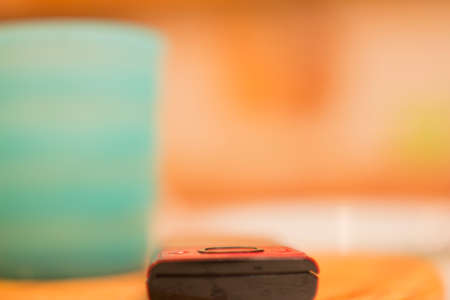 A mobile phone with a blurred background.の写真素材