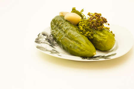 plate of pickled cucumbers isolated on white background.の写真素材