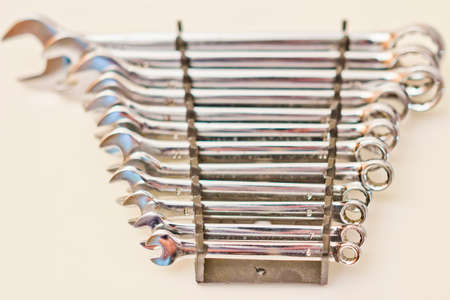 A set of open end wrench on a white background