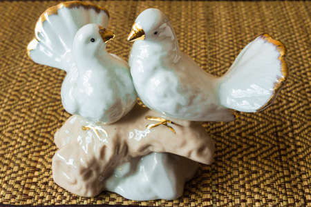 Decorative sculpture is made of porcelain, made in the form of two doves .の写真素材