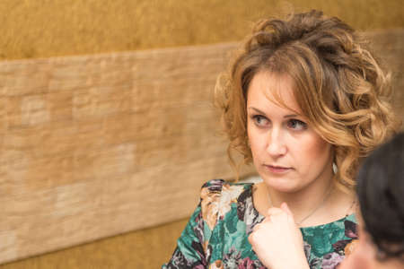 Portrait of a young girl resting in a cafe.の写真素材