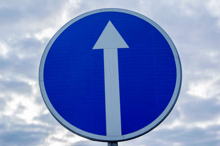 Road sign isolated on a blue sky backgroundの写真素材