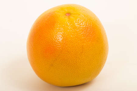 Ripe and fresh grapefruit on a white backgroundの写真素材