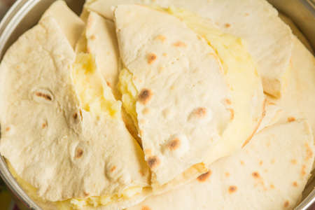 It is roasted on the fire cake dough, which are filled with mashed potatoesの写真素材