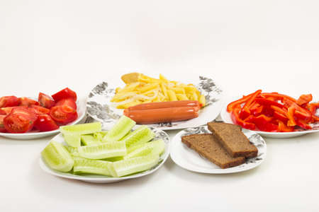 The food laid out on a glass plate on a white backgroundの写真素材