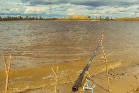 Spinning mounted on wooden Raguli on the river bankの写真素材