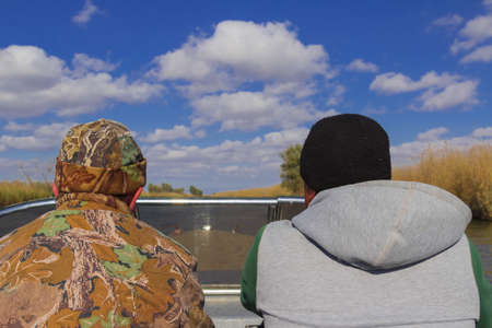 The men on the boat go on a fishing tripの写真素材
