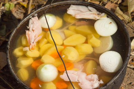 Pot with cooking ingredients for cooking fish soupの写真素材