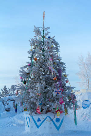 Dressed Christmas tree in the courtyard of an Orthodox church