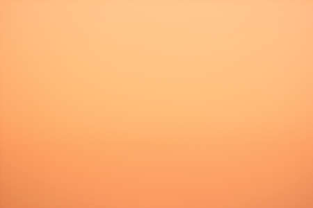 Background to the presence of soft shades of orange and yellowの写真素材
