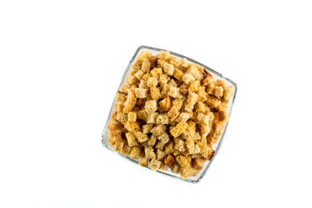 Rye crackers in glass bowl isolated on white backgroundの写真素材