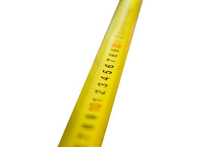 Yellow folding measuring tool on a white background