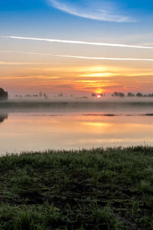 Sunrise in the fogの写真素材