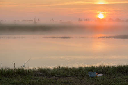 Sunrise in the fogの写真素材