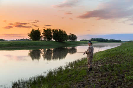 Pike hunter on the riverの写真素材