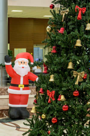 Christmas tree in the hall for Christmas celebrations, decorated and ready to meet childrenの写真素材