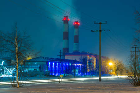 The night landscape of a small provincial town glowing in multicolored lightsの写真素材