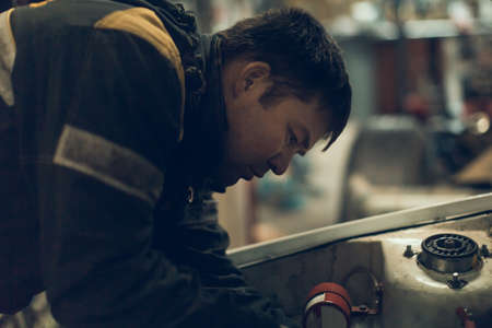 Car master performs urgent order for car repairの写真素材