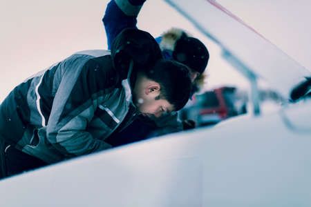 The master examines the sports car engine before the raceの写真素材