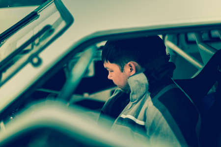 Pilot Nurali at the wheel of a sports car ready for racing on iceの写真素材