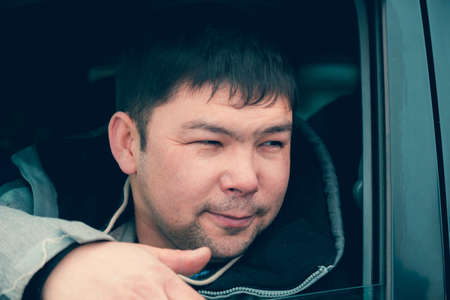 A man from the SUV with someone talkingの写真素材