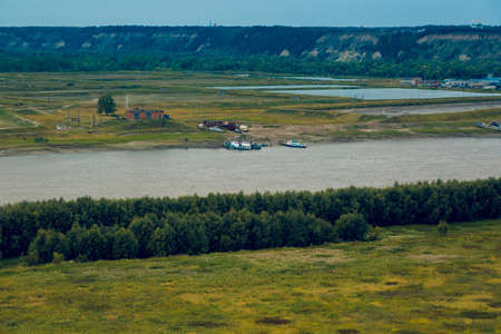 Panorama from the steep bank of the Irtysh River on a September spring day