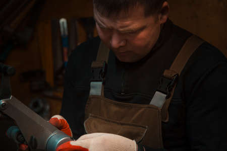 Portrait of a locksmith in the workplace